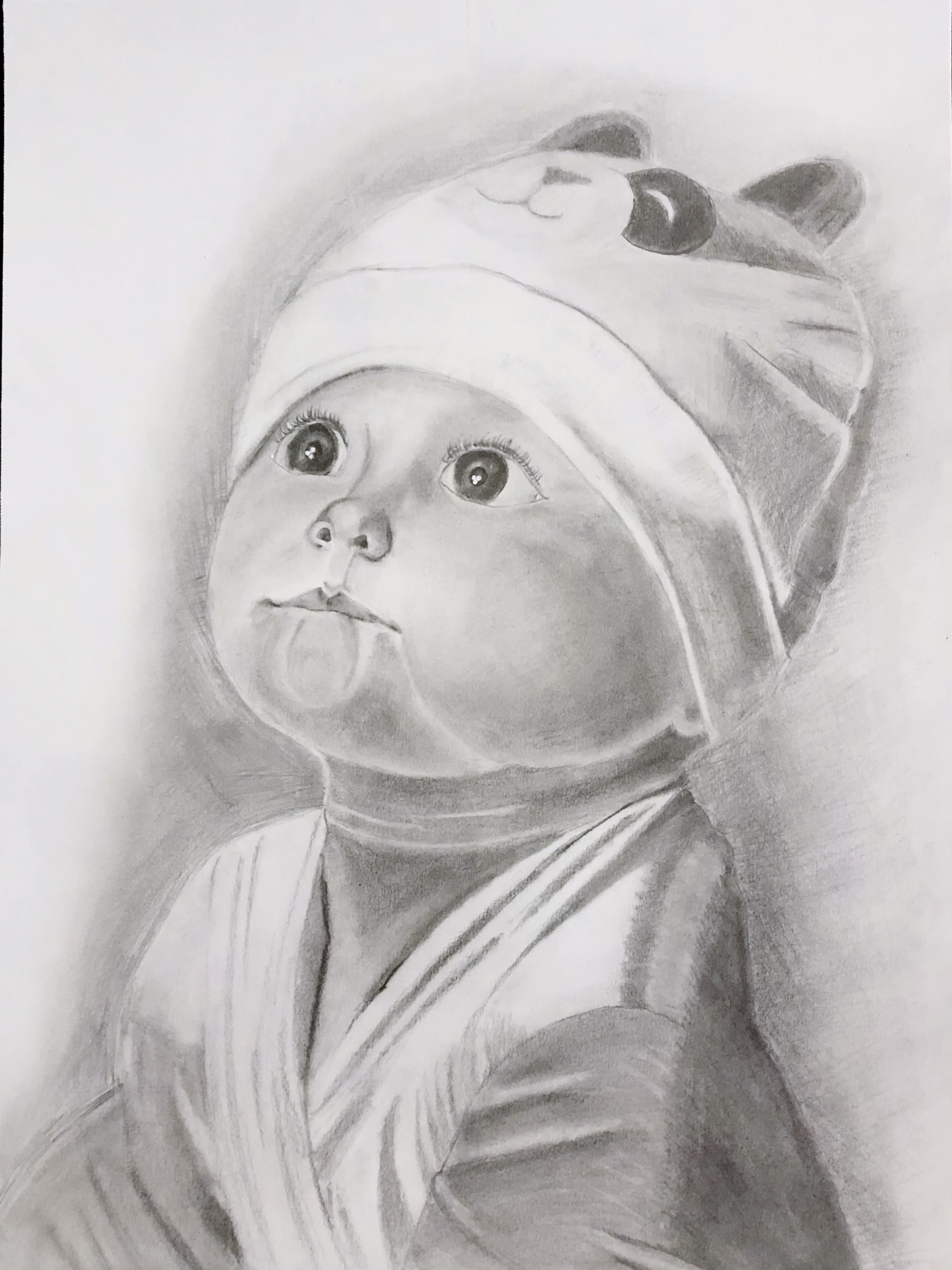 black and white portrait of a baby looking up